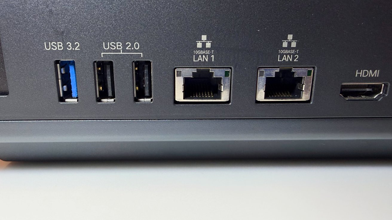 Rear panel of the Ugreen iDX6011 Pro showing dual 10GBASE-T LAN ports and HDMI output
